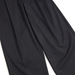 Pantalones anchos plisados