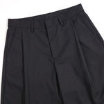 Pantalones anchos plisados