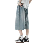 Pantalones vaqueros desgastados de pierna ancha y corte cropped