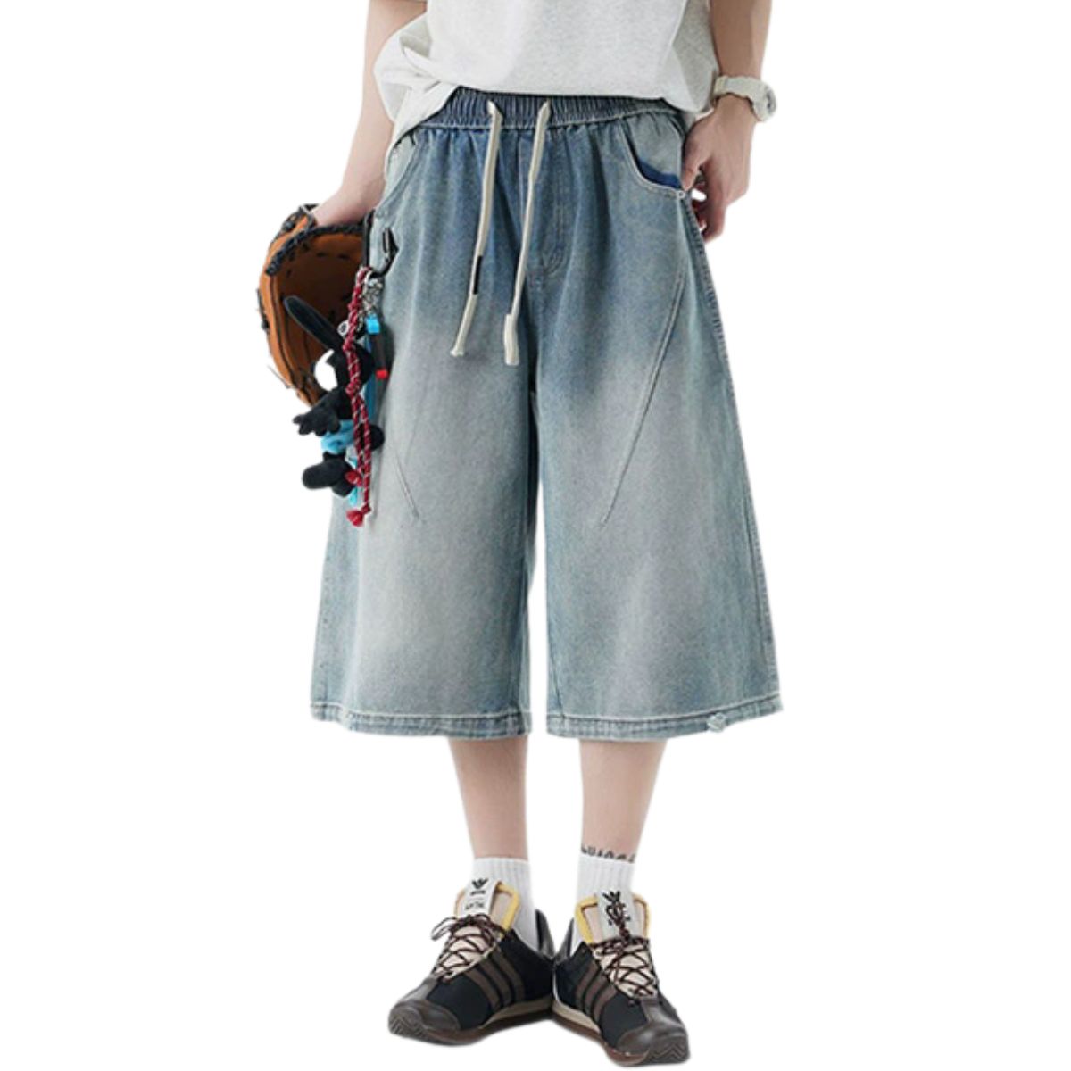 Pantalones vaqueros desgastados de pierna ancha y corte cropped