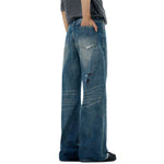 Vaqueros rotos, parcheados y pintados