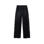 Vaqueros de cintura alta con aberturas y cuentas de perlas