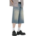 Vaqueros desgastados de pierna ancha y corte cropped