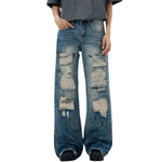 Vaqueros rotos, parcheados y pintados