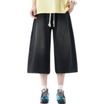 Pantalones vaqueros desgastados de pierna ancha y corte cropped