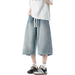 Pantalones vaqueros desgastados de pierna ancha y corte cropped