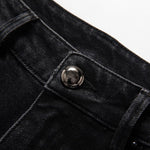 Vaqueros de cintura alta con aberturas y cuentas de perlas