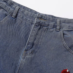 Bermudas vaqueras rasgadas con parches de camuflaje