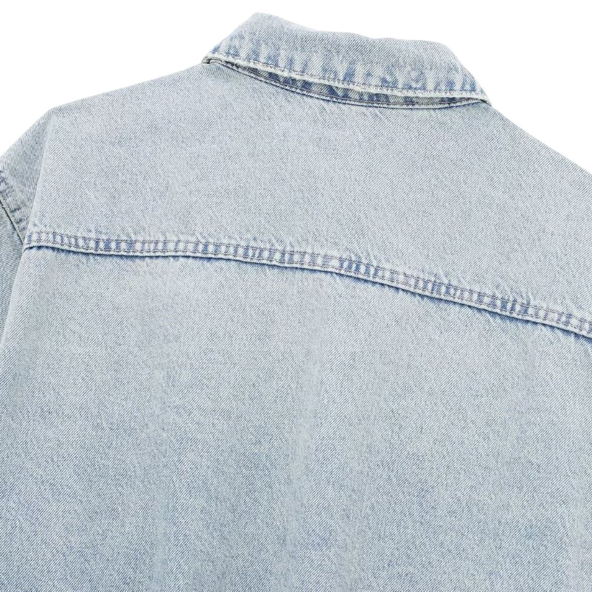 Vestido midi vaquero sin mangas con botones y aberturas en la parte delantera