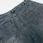 Bermudas vaqueras rasgadas con parches de camuflaje