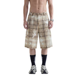Bermudas vaqueras rasgadas con parches de camuflaje