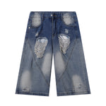 Bermudas vaqueras rasgadas con parches de camuflaje