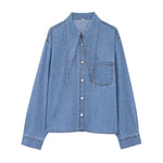 Vestido midi vaquero sin mangas con botones y aberturas en la parte delantera