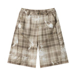 Bermudas vaqueras rasgadas con parches de camuflaje