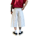 Bermudas con lavado vintage y salpicaduras de tinta