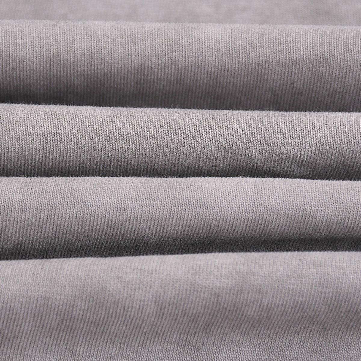 Camiseta sin mangas con borde sin rematar y costura trasera de 7.5 oz