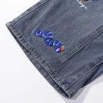 Bermudas vaqueras rasgadas con parches de camuflaje