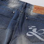 Bermudas vaqueras rasgadas con parches de camuflaje