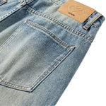 Vaqueros desgastados de pierna ancha y corte cropped