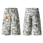 Bermudas de mezclilla desgastada con estampado de salpicaduras