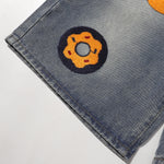 Bermudas vaqueras rasgadas con parches de camuflaje