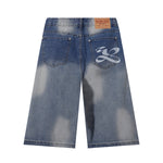 Bermudas vaqueras rasgadas con parches de camuflaje