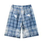 Bermudas vaqueras rasgadas con parches de camuflaje