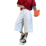 Bermudas con lavado vintage y salpicaduras de tinta