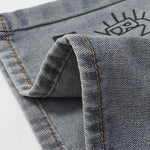 Bermudas vaqueras rasgadas con parches de camuflaje