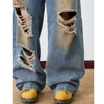 Distressed Barrel Leg Denim Jeans with Heavy Rip Details