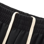 Pantalones deportivos holgados de color gris oscuro