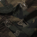 Bermudas vaqueras rasgadas con parches de camuflaje