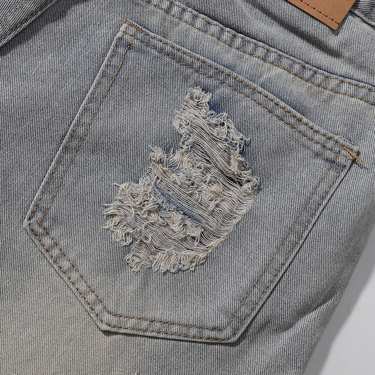 Bermudas vaqueras rasgadas con parches de camuflaje