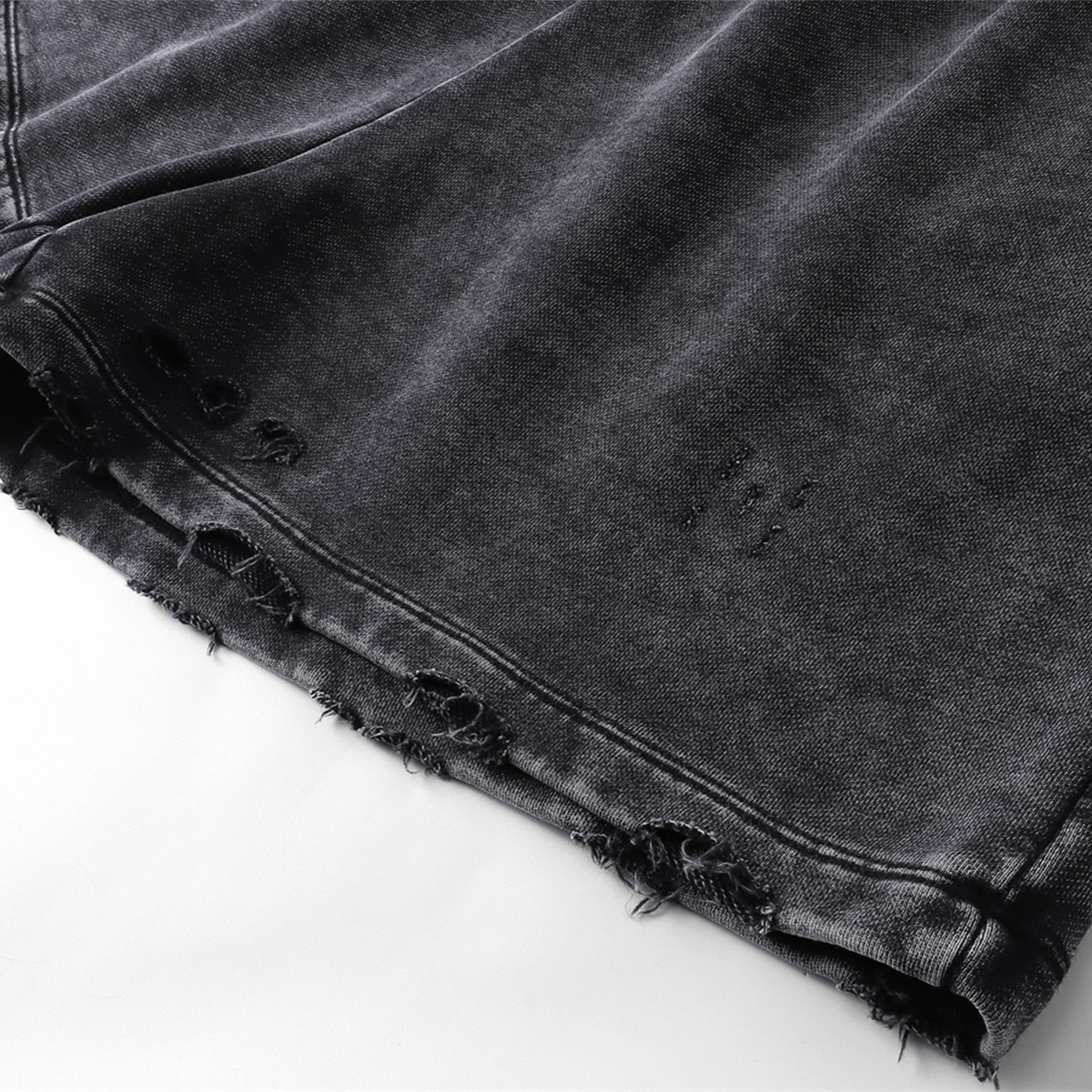 Pantalones cortos desgastados con lavado a la piedra