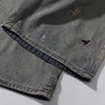 Bermudas vaqueras rasgadas con parches de camuflaje