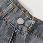 Bermudas vaqueras rasgadas con parches de camuflaje