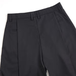 Pantalones anchos plisados