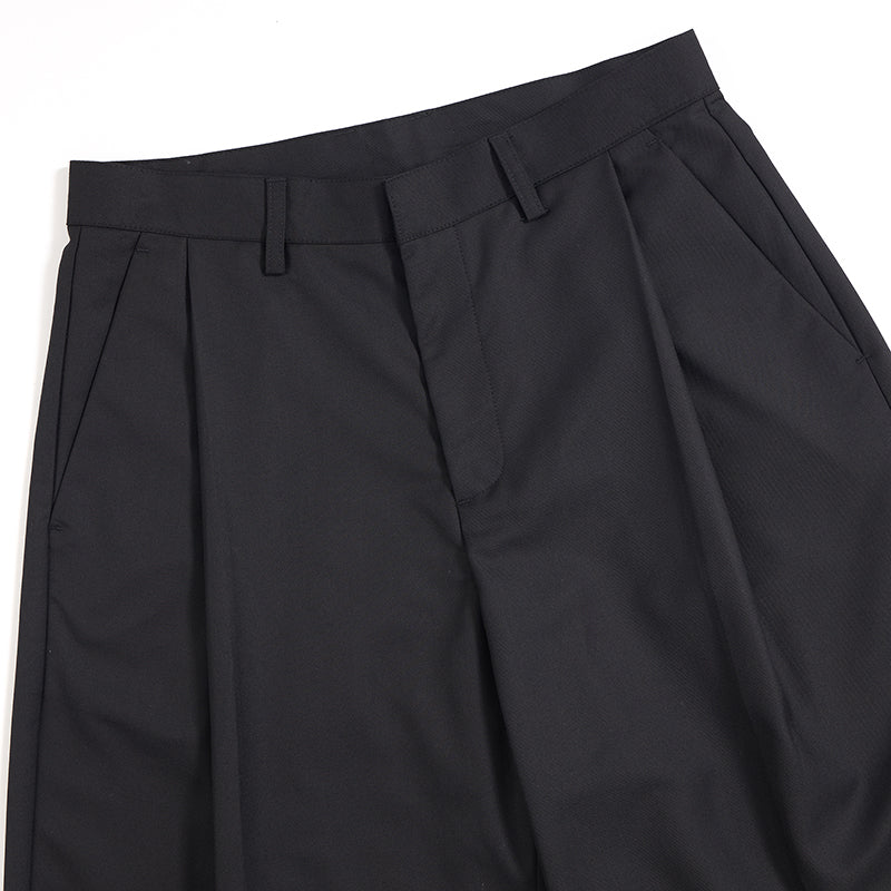 Pantalones anchos plisados