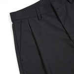 Pantalones anchos plisados