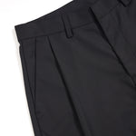 Pantalones anchos plisados