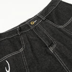Bermudas vaqueras rasgadas con parches de camuflaje