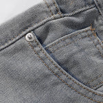 Bermudas vaqueras rasgadas con parches de camuflaje