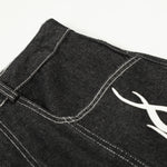 Bermudas vaqueras rasgadas con parches de camuflaje