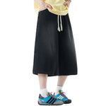 Pantalones vaqueros desgastados de pierna ancha y corte cropped