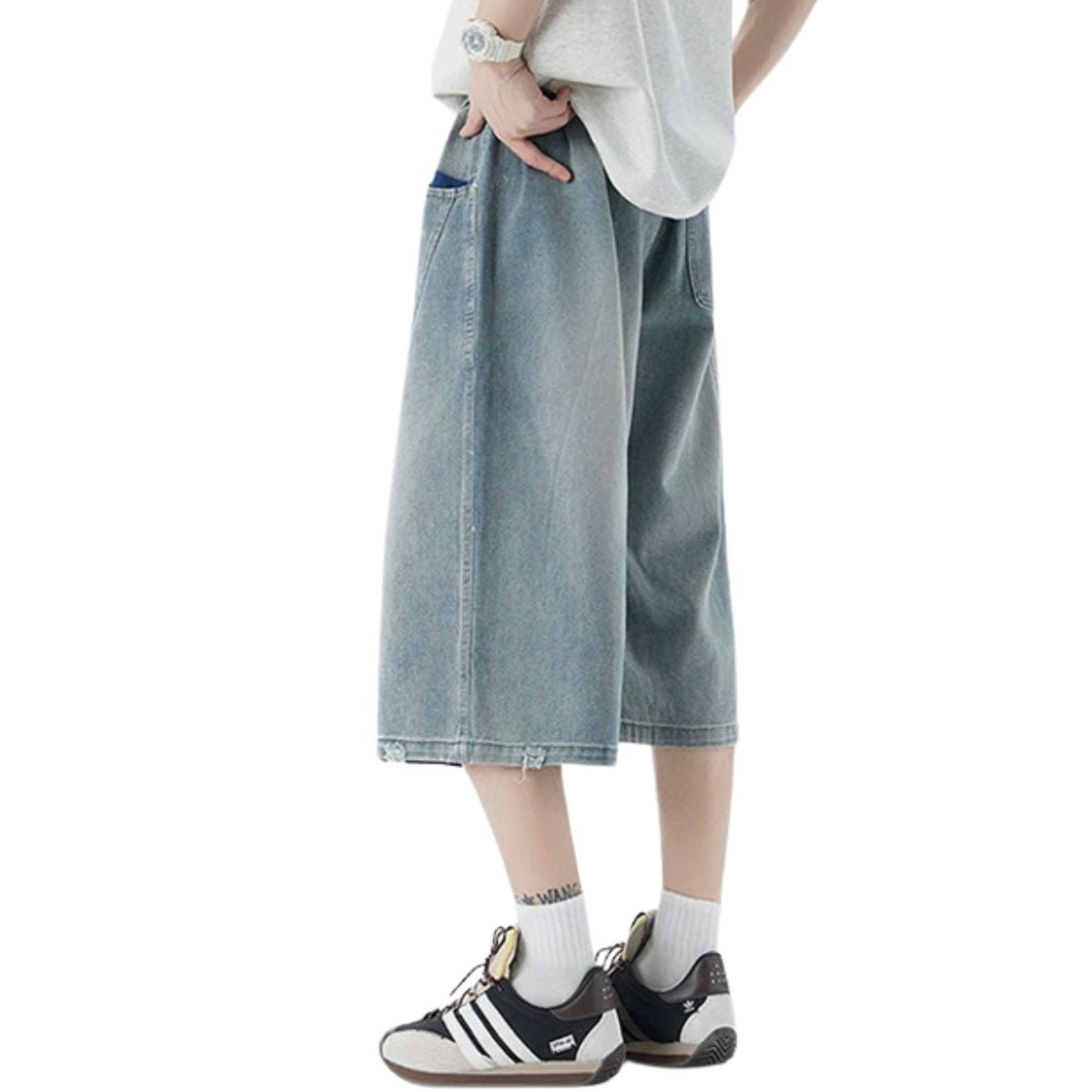 Pantalones vaqueros desgastados de pierna ancha y corte cropped