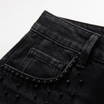 Vaqueros de cintura alta con aberturas y cuentas de perlas