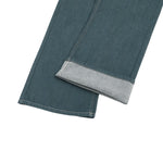 Raw Denim Jeans with Teal Multi‑Button Fly Design