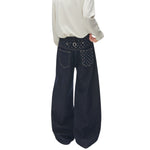 Star‑Print Curved Blade Raw Denim Jeans