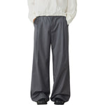 Pantalones anchos plisados