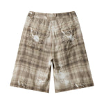 Bermudas vaqueras rasgadas con parches de camuflaje